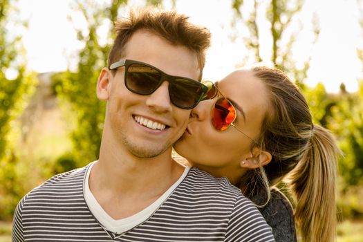 Portrait of a happy young couple embraced