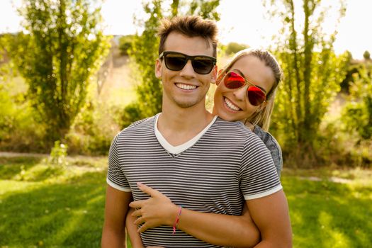 Portrait of a happy young couple embraced