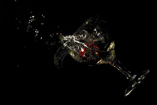 glass dropping with strawberry inside