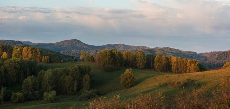 Beauty dawn in the mountains in Altay, panoramic picture