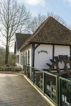 The recently restored historic water mill called The Olliemölle or Den Helder in the stream of the river the Boven-Slinge in Winterswijk in Hamlet the Achterhoek in the Netherlands. The water mill is a national monument and the restoration is completed in 2016.
