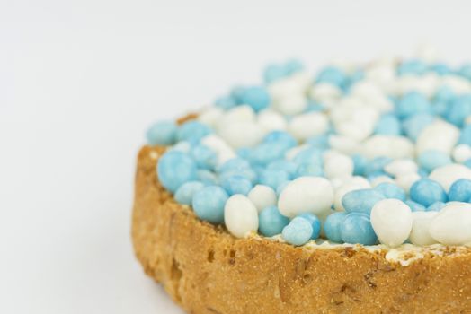 Rusks with blue anise sprinkles is a Dutch tradition related to the celebration of the birth of a boy. Sprinkles are sugared anise seeds that serve as sweet toppings.
