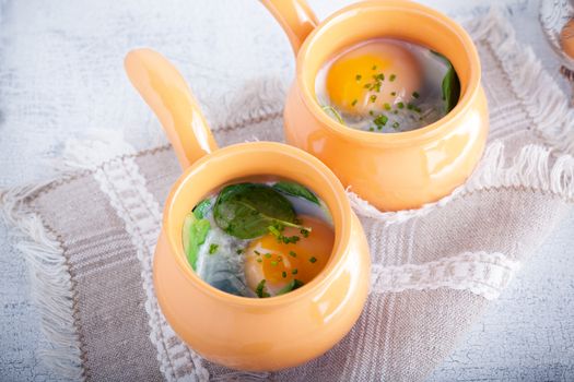 Casserole with eggs, spinach and parmesan for breakfast