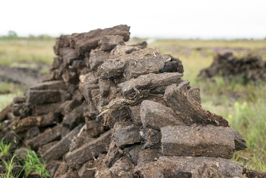 turf stacked up for the bog winds to dry in county kerry on the wild atlantic way of ireland