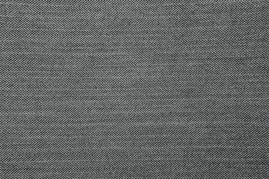 Grey herringbone fabric pattern texture background closeup