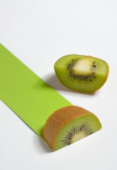 Kiwi fruit sliced and green path on white background