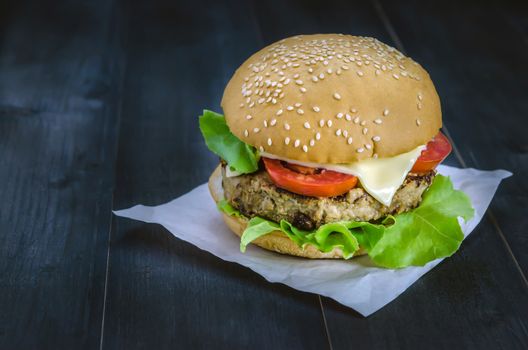 Closeup of home made burgers on wooden background