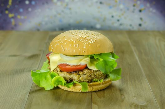Closeup of home made burgers on wooden background