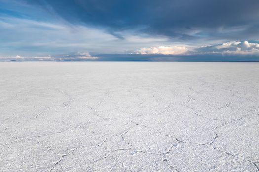 Sunset in Salar de Uyuni salt flats desert, Andes Altiplano, Bolivia