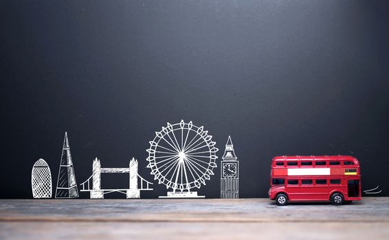 London landmarks drawn on a blackboard with a double decker bus 