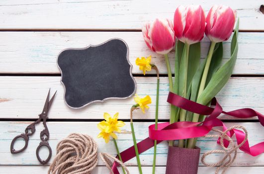 Spring tulip bouquet with small blackboard sign