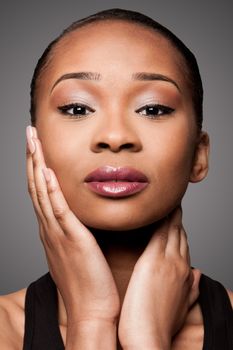 Beautiful face of black Asian blasian woman with cosmetics makeup, skincare concept.