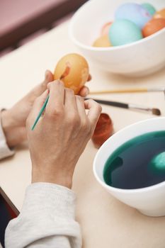 Woman preparing Easter eggs