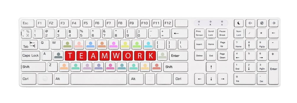 The white computer keyboard conceptual teamwork.