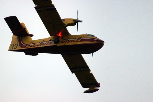 Menton, France - September 9, 2015: Canadair CL-415 (Securite Civile) Airplane Extinguish Forest in Flame in Menton, French Riviera