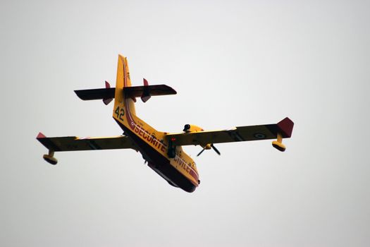 Menton, France - September 9, 2015: Canadair CL-415 (Securite Civile) Airplane Extinguish Forest in Flame in Menton, French Riviera