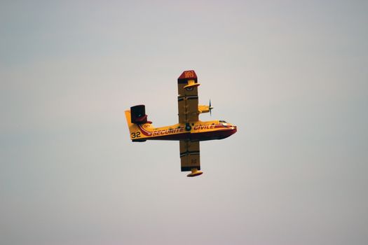 Menton, France - September 9, 2015: Canadair CL-415 (Bombardier 415 Superscooper) Airplane Extinguish Forest in Flame in Menton, French Riviera