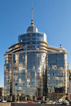 SAINT-PETERSBURG, RUSSIA June 7: High-rise building of concrete and glass with a long spike on the background of blue sky, June 7, 2016 in Saint-petersburg.