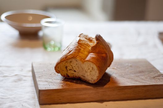 a piece of bread on a wooden cutting board