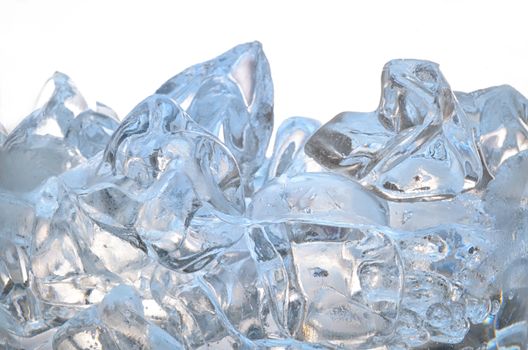 Glass with frozen ice cubes isolated on white