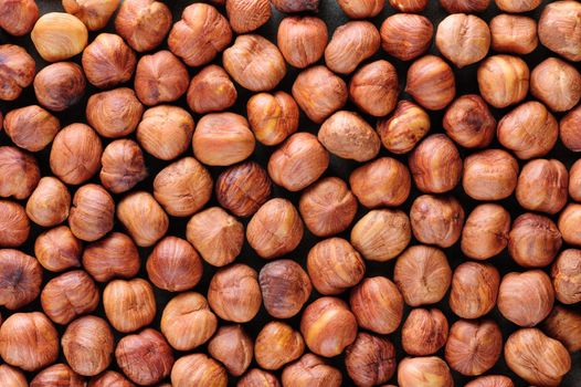 Background texture of Peeled hazelnuts macro closeup