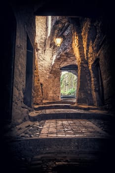 Narrow and old street or alley in italian town. Historical view of Italy