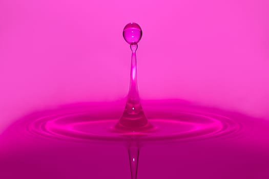 high speed purple water drop splashing 