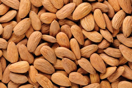 Dried almonds kernels, macro closeup background texture
