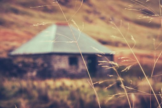 A Scottish Bothy, or Hut Or Cottage In The Winter With Grass In The Foreground