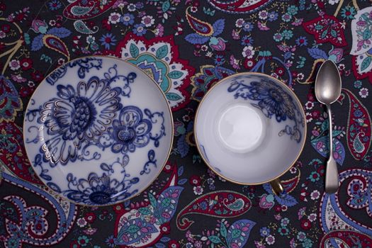 tea cup saucer porcelain Blue gold floral pattern overhead view