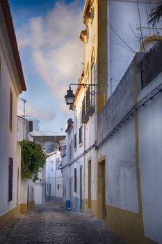 narrow street in the historic city of Evora Portugal