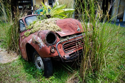 Abandoned old rusty car. Retro vintage background