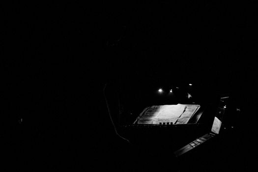black and white Keyboard and sheet music