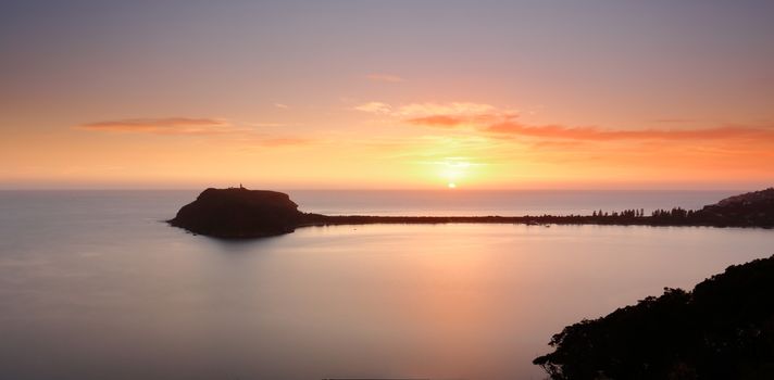 Beautiful serene and perfect sunrise skies and long exposure taken from Kur-ring Gai National Park overlooking Barrenjoey and Pittwater