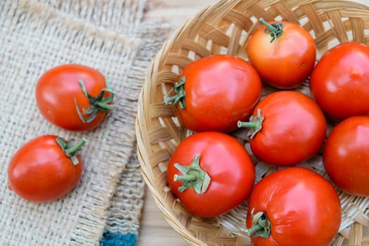 Ripe red tomatoes on bamboo basket