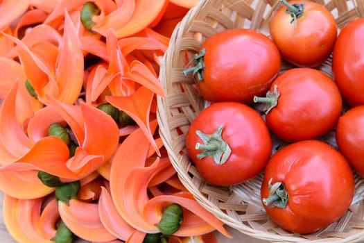 Ripe red tomatoes on bamboo basket