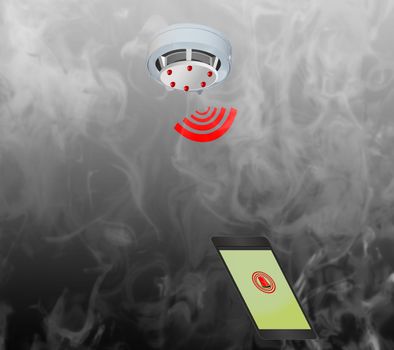 Smoke detector on the ceiling with red warning light sensor and smoke. Send warning message to the mobile phone.