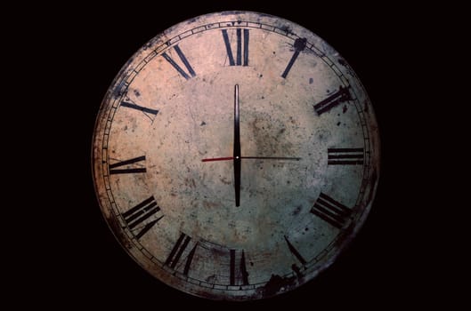 Antique clock on a black background