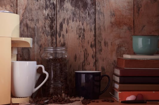 Coffee and book on the old wooden table.