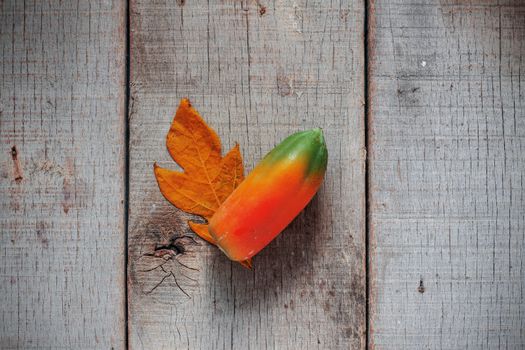 Papaya on the old wood and dirty.