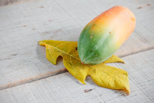 Papaya on the old wooden floor.