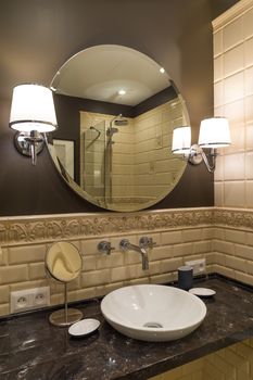 Circle mirror, Washbasin faucet luxurious bathroom