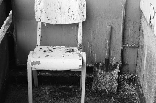 Dirty old chair on black and white theme