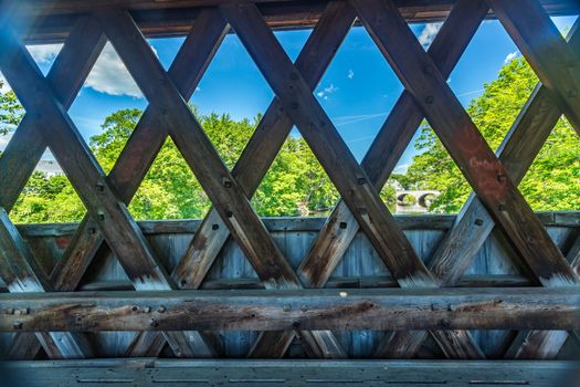 The Henniker Covered Bridge is a covered pedestrian footbridge serving New England College across the Contoocook River in Henniker, New Hampshire.