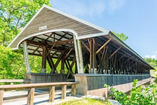 Rowell Covered Bridge is a covered bridge in Hopkinton, New Hampshire which carries Rowell Bridge Road over the Contoocook River. It is a long truss style bridge.