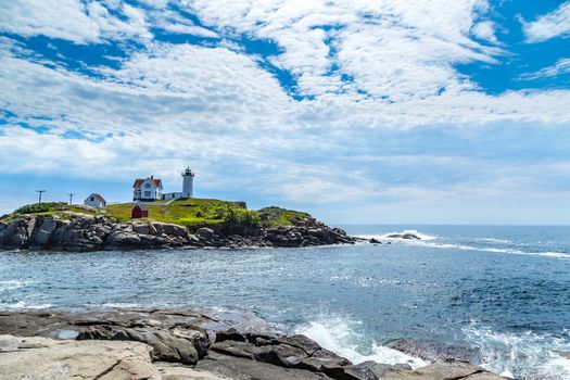 The Cape Neddick Light stands on Nubble Island about 100 yards off Cape Neddick Point. It is commonly known as "Nubble Light" or simply "the Nubble".