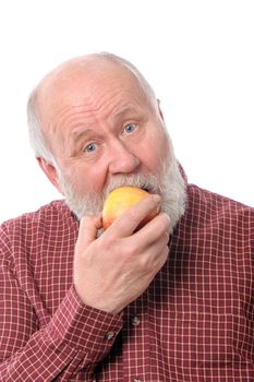 Handsome bald and bearded senior man eating the apple, isolated on white background