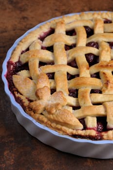 cherry pie dough with decorative ornaments in  roasting pan close-up