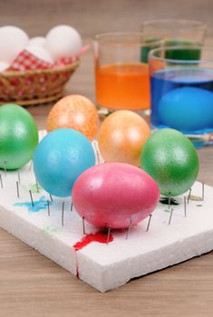 Preparing for the holiday Easter. The process of painting eggs with food coloring