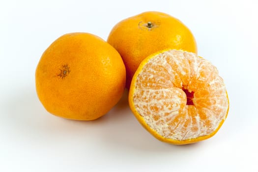 Ripe oranges isolated on white background. Orange in a cut.